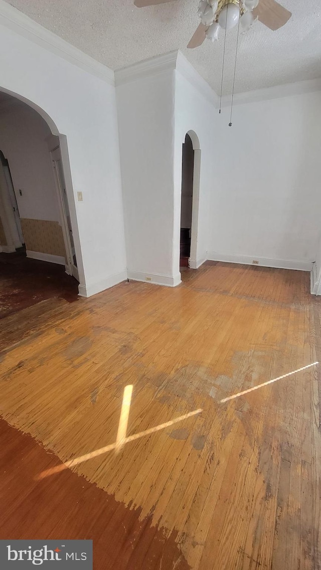 spare room featuring ceiling fan, a textured ceiling, and hardwood / wood-style floors