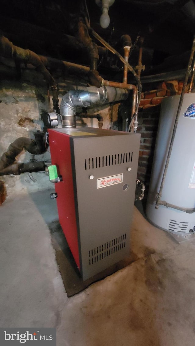 utility room featuring gas water heater