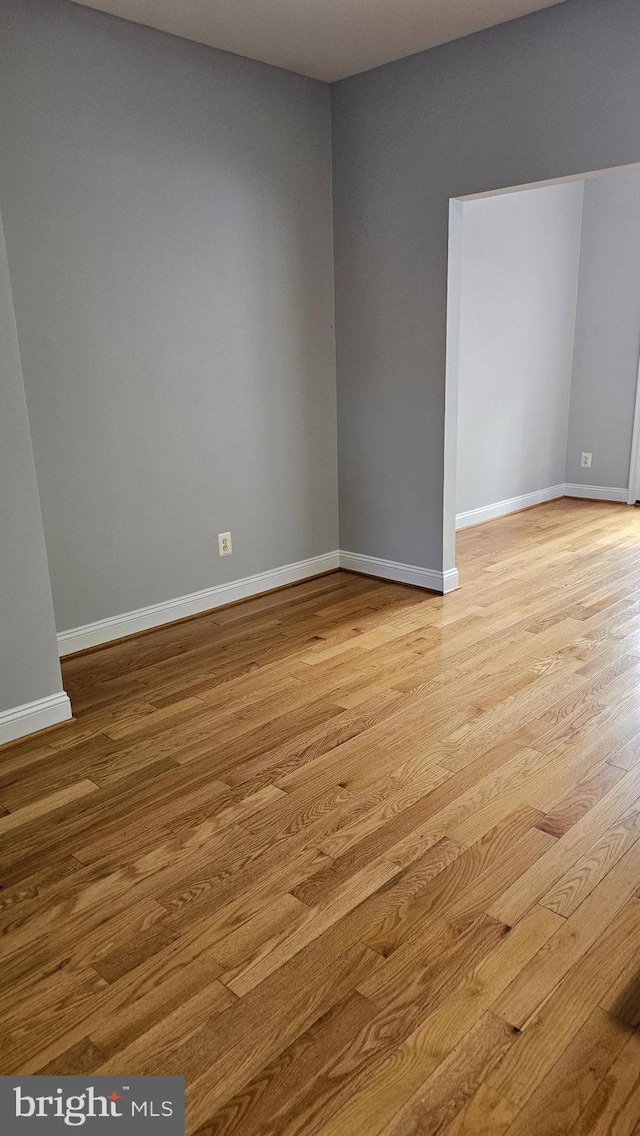 spare room featuring light hardwood / wood-style flooring