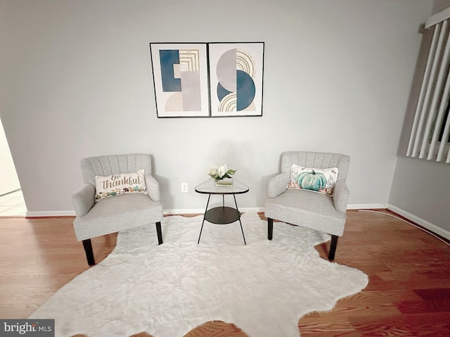 living area featuring hardwood / wood-style floors