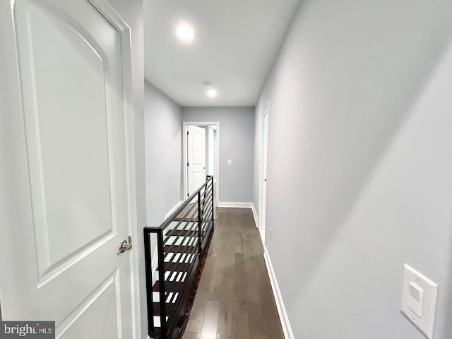 hall with dark wood-type flooring