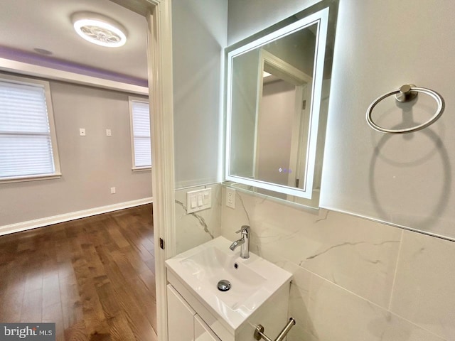 bathroom with vanity and hardwood / wood-style flooring