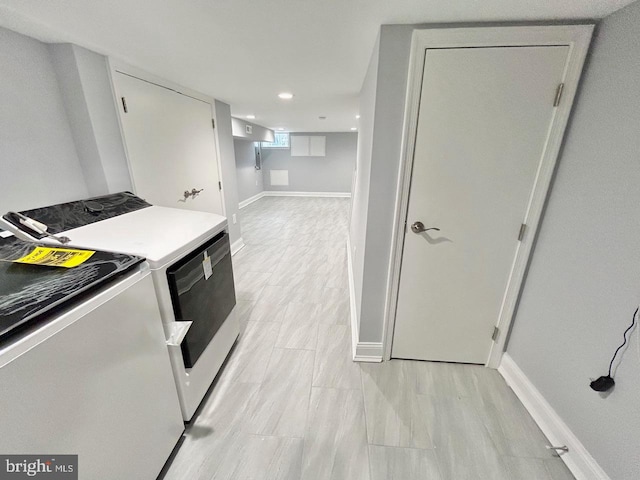 kitchen with white cabinetry and independent washer and dryer