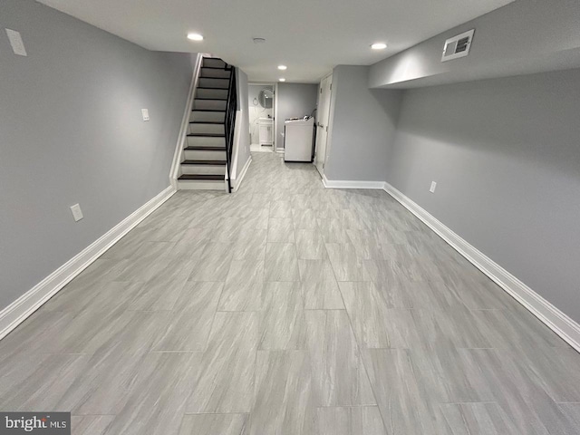 basement featuring light wood-type flooring