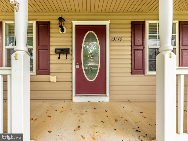 property entrance with covered porch