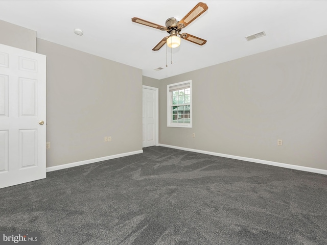 carpeted empty room with ceiling fan