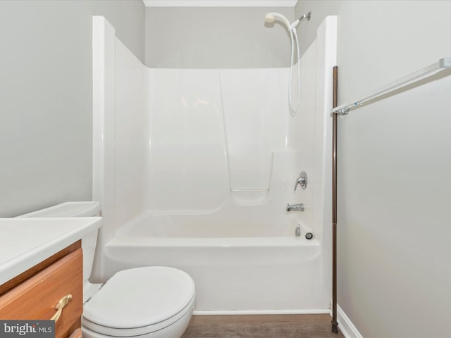 full bathroom with tub / shower combination, vanity, and toilet