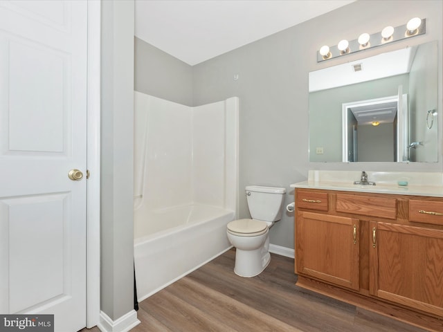 full bathroom featuring vanity, shower / bathing tub combination, toilet, and hardwood / wood-style floors