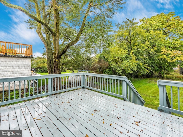 wooden deck with a yard