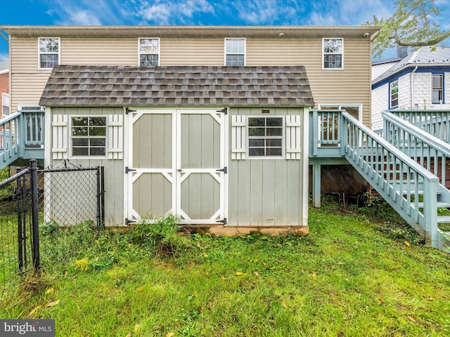 view of outbuilding with a yard