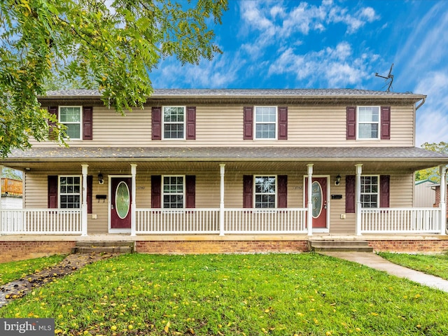 view of front of property featuring a porch and a front lawn