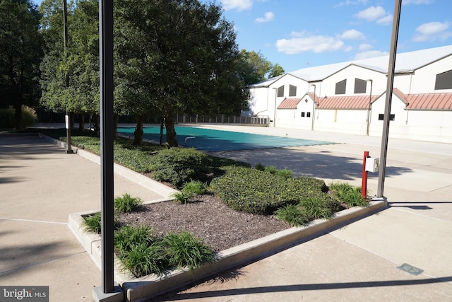 exterior space with a covered pool