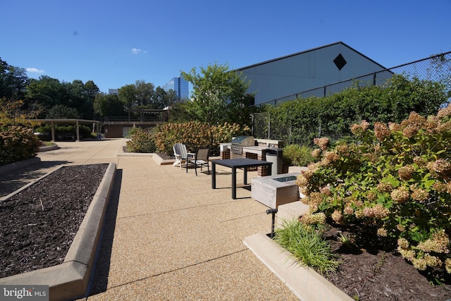 view of property's community with a patio