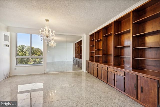 interior space with ornamental molding, a textured ceiling, and a chandelier