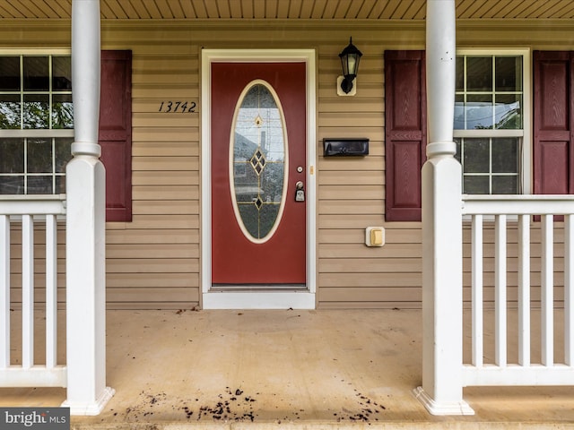 doorway to property with a porch