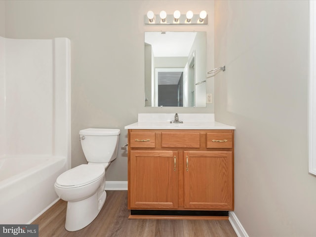 full bathroom with vanity, shower / bathtub combination, toilet, and wood-type flooring