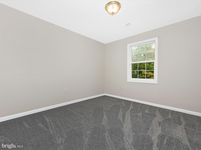 unfurnished room with carpet floors