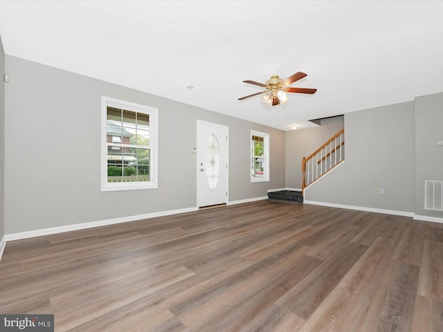 interior space with ceiling fan and hardwood / wood-style floors