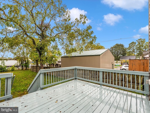 wooden deck featuring a yard