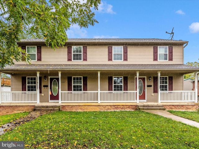 view of front of home featuring a porch and a front yard