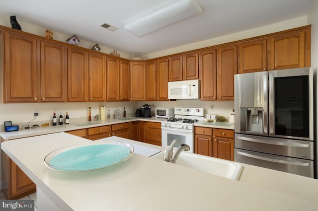 kitchen with white appliances and sink