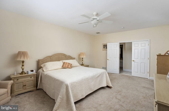 bedroom with ceiling fan and light colored carpet