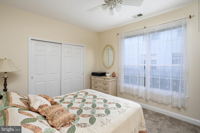 bedroom featuring carpet floors, a closet, and ceiling fan