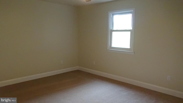 empty room with carpet flooring