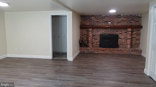 unfurnished living room with dark hardwood / wood-style floors