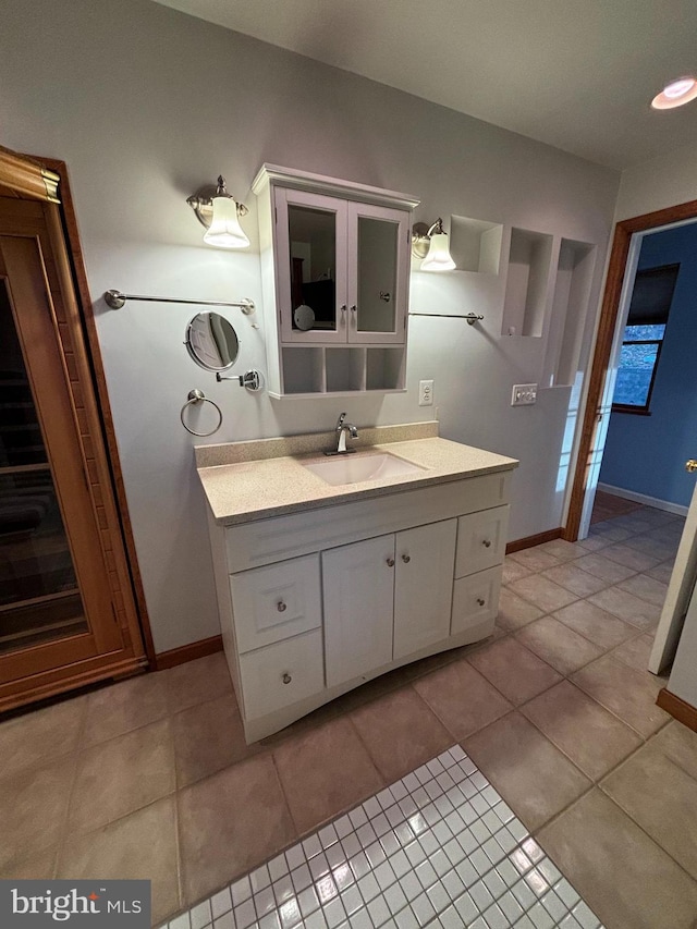 bathroom with tile patterned flooring and vanity