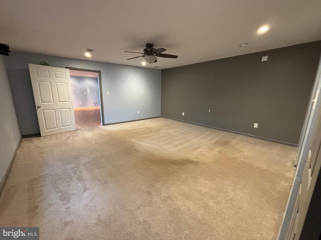 empty room with light carpet and ceiling fan