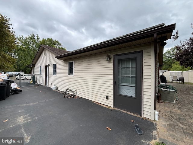 view of side of home featuring a patio area