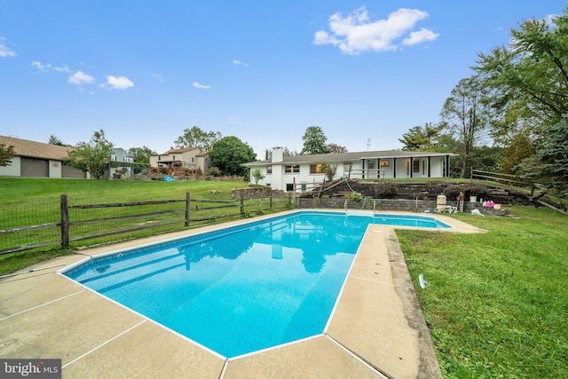 view of pool featuring a yard