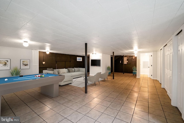 playroom featuring pool table, wood walls, and light tile patterned floors