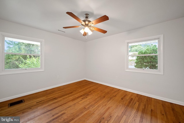 spare room with ceiling fan and hardwood / wood-style floors