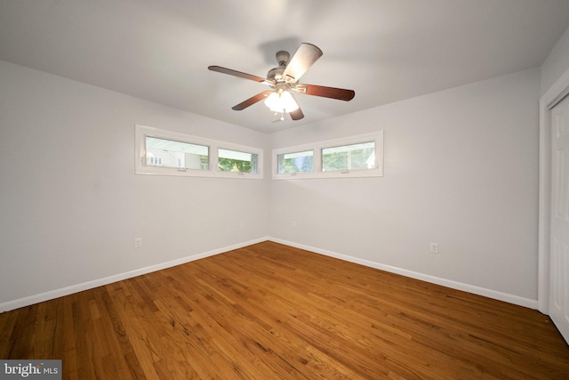 unfurnished room featuring hardwood / wood-style flooring and ceiling fan