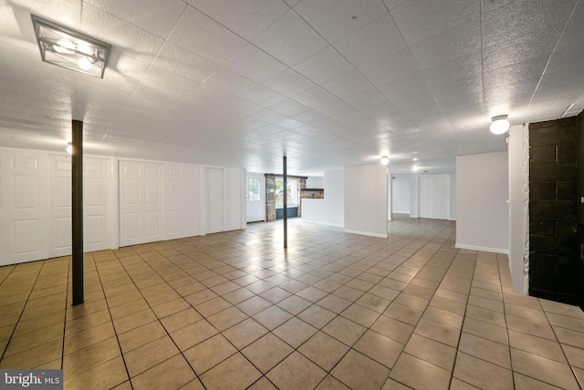 basement with light tile patterned floors