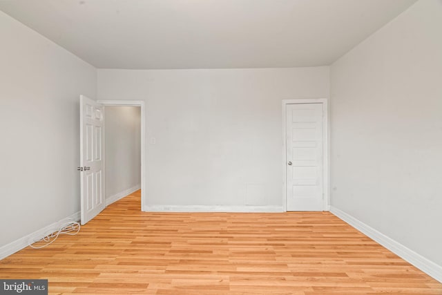 unfurnished room featuring light wood-type flooring