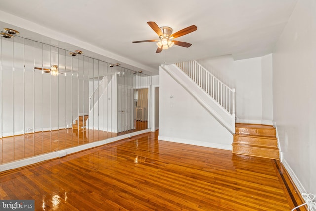 unfurnished room with ceiling fan and hardwood / wood-style floors