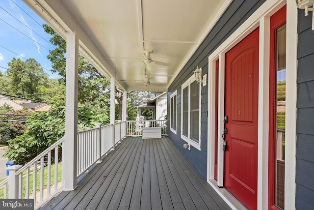 wooden deck with ceiling fan and a porch