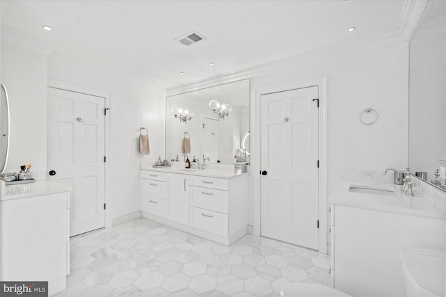 bathroom with tile patterned flooring, ornamental molding, and vanity