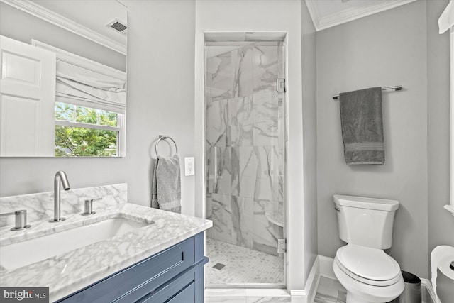 bathroom with ornamental molding, vanity, toilet, and a shower with door