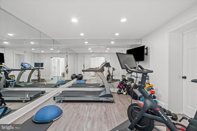 gym with wood-type flooring