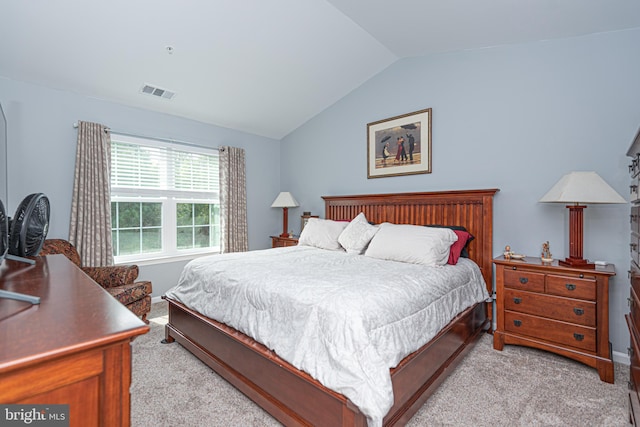 carpeted bedroom featuring vaulted ceiling