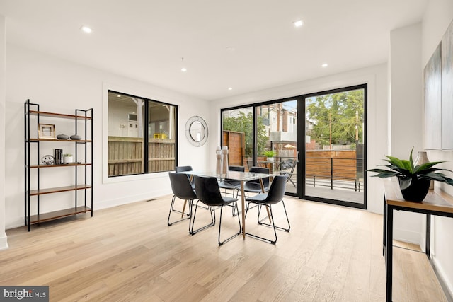 dining area featuring light wood-type flooring