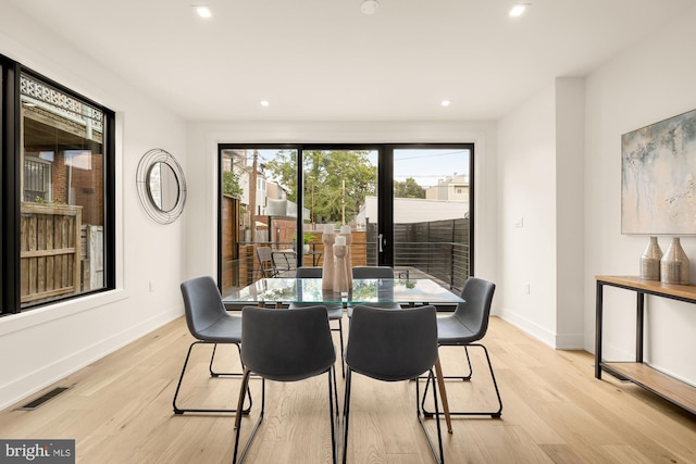 dining area with light hardwood / wood-style flooring