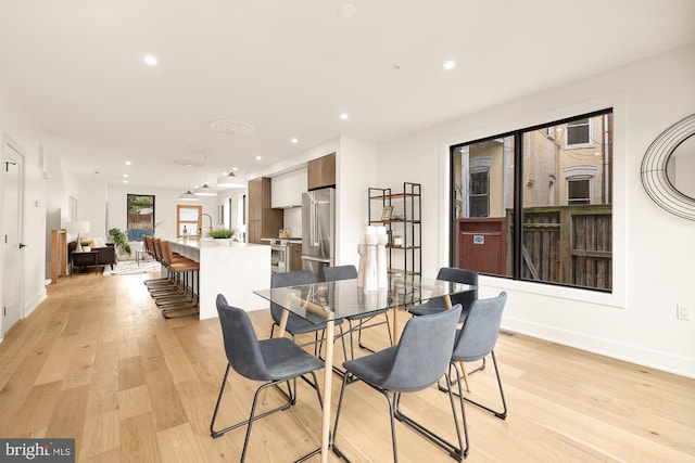 dining space featuring light hardwood / wood-style flooring