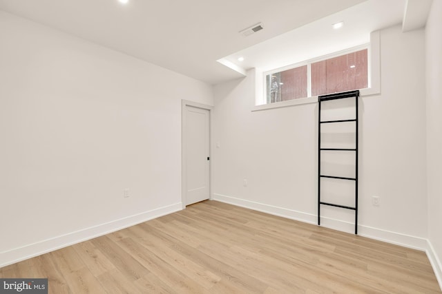 empty room with light hardwood / wood-style floors