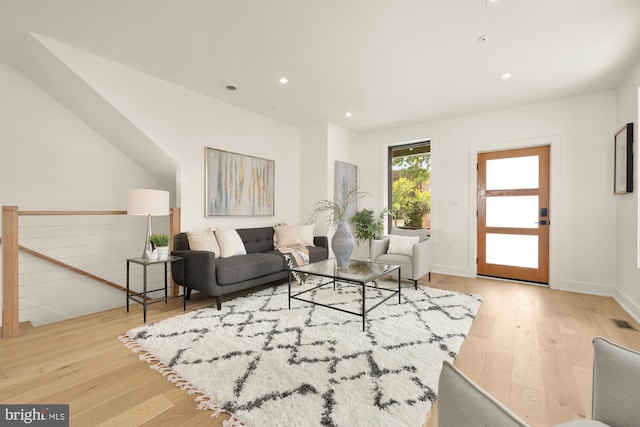 living room with light hardwood / wood-style flooring