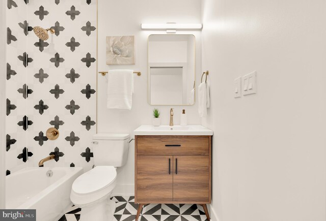 full bathroom featuring vanity, toilet, and washtub / shower combination